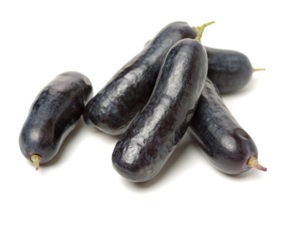 istock Raw organic organic long purple grape on white background 1087823634