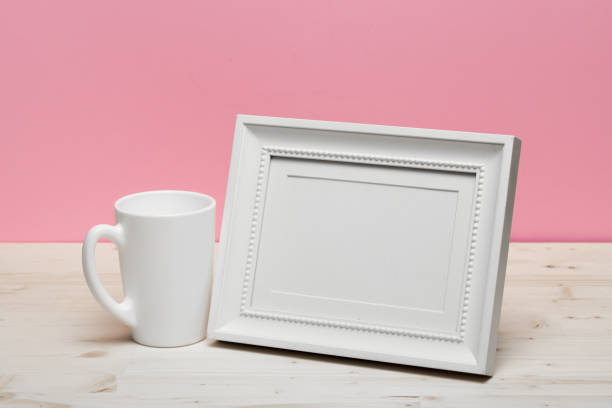 istock white frame with mug on white desk near pink wall 1087825118