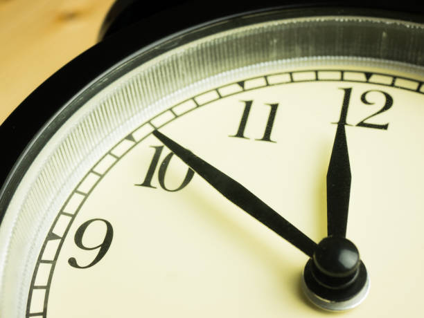 istock Alarm Clock on wooden background 1087826182