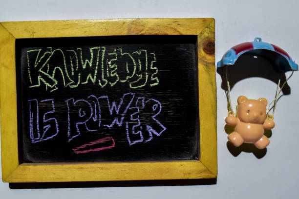 istock Knowledge is Power on phrase colorful handwritten on blackboard 1087833602