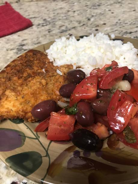 istock Dinner plate of chicken, rice and salad 1087833652