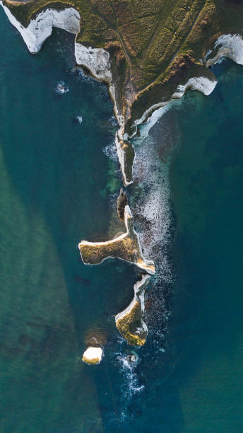 Aerial overview of old harry rocks Aerial overhead views of the chalk purbeck coastline, showing coastal erosion during autumn sunlight. old harry rocks stock pictures, royalty-free photos & images