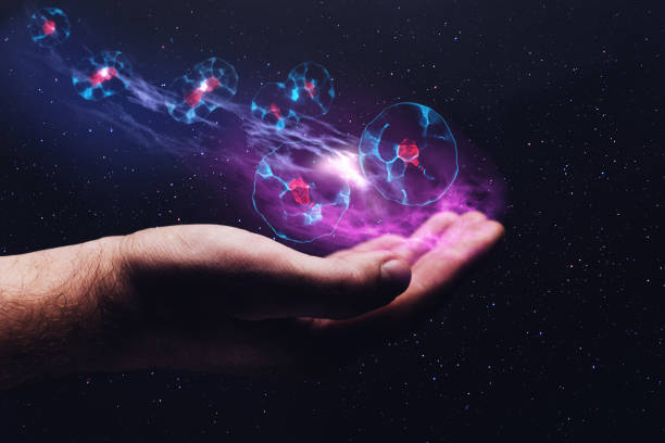 istock Human hand holding cell dividing. Mixed media. 1087836134