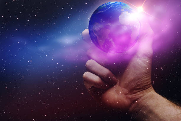 istock Whole world in hands and nebula dust. Mixed media . 1087837896