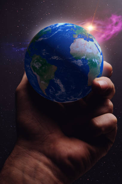 istock Whole world in hands and nebula dust. Mixed media . 1087837910