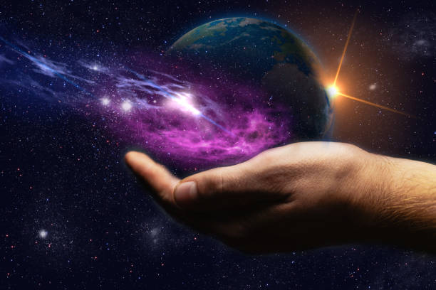 istock Whole world in hands and nebula dust. Mixed media . 1087837920