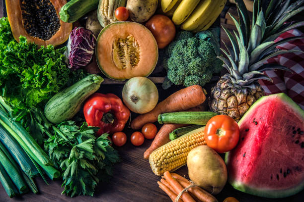 istock Organic tropical fruits and vegetables in old fashioned rustic kitchen 1087839438