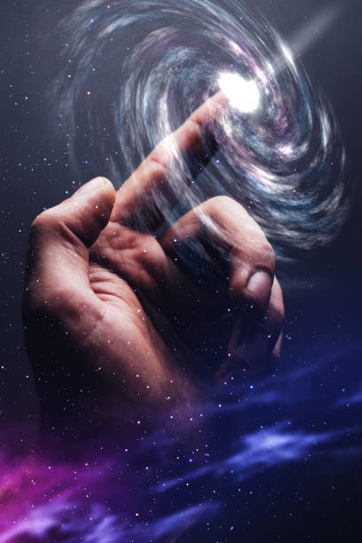 istock Forefinger touches a Galaxy  in infinite space. Mixed media. 1087839834