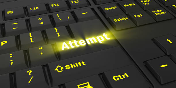 istock yellow glowing Attempt key on black keyboard 1087847496