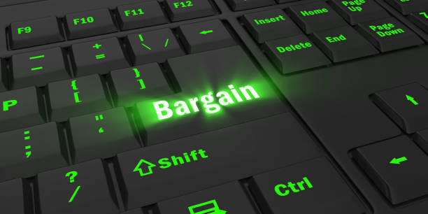 istock green glowing Bargain key on black keyboard 1087847608
