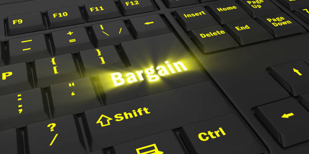 istock yellow glowing Bargain key on black keyboard 1087847674