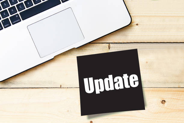 istock Update - handwritten text in a black sticky note on wooden table 1087849798