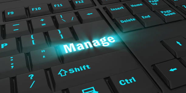 istock blue glowing Manage key on black keyboard 1087852092