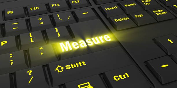 istock yellow glowing Measure key on black keyboard 1087852140