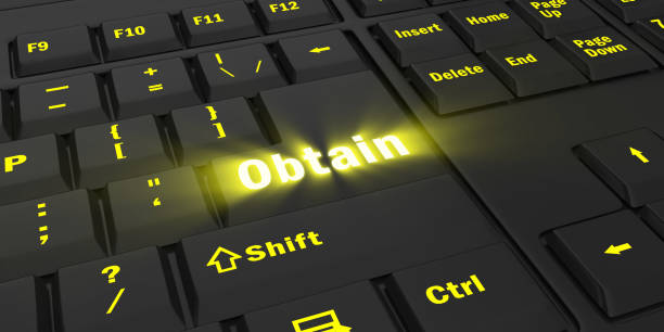 istock yellow glowing Obtain key on black keyboard 1087852340