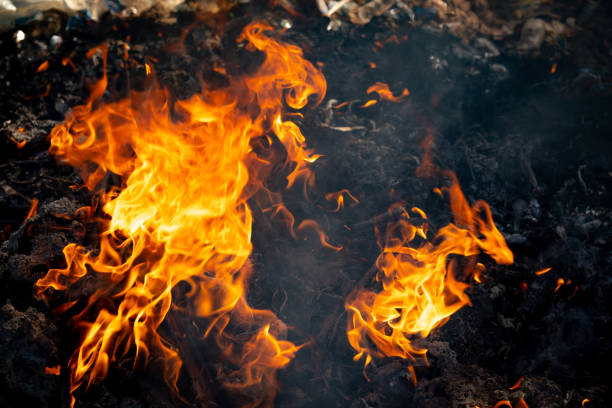 istock Fire flame burning garbage to air pollution in industry 1087852600