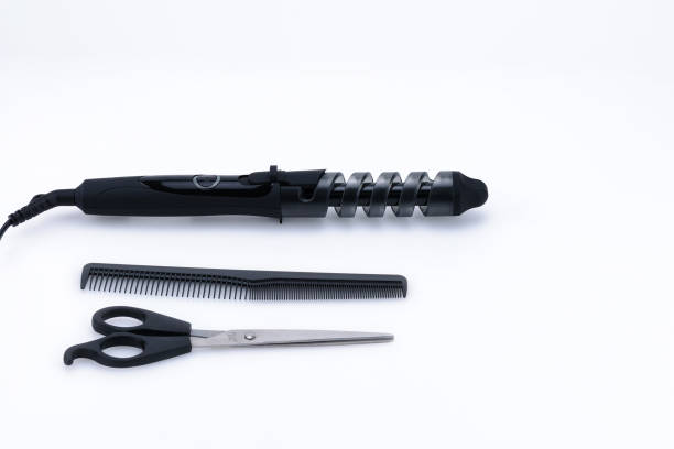 istock Grey hair iron with accessory on the white background with copy space. 1087856504