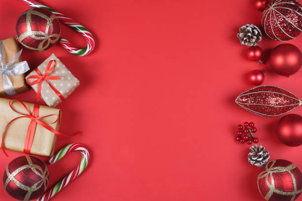 istock Presents and Christmas accessories on red background. 1087863696
