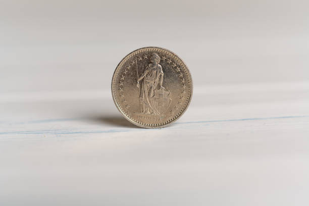 istock Back of a 1 CHF Swiss franc coin standing on a table 1087863760