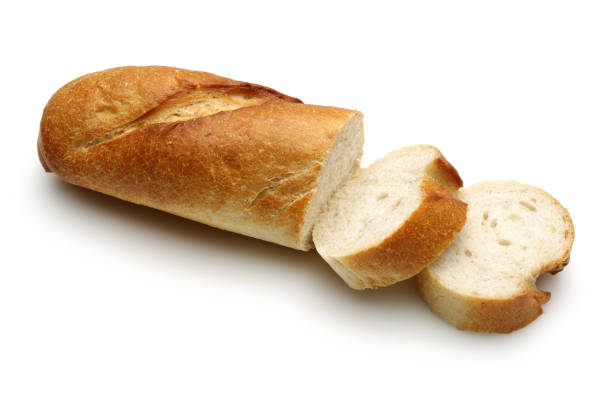 pane francese, baguette con fette su sfondo bianco - baguette foto e immagini stock