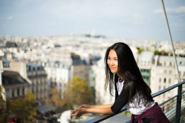 tourist cinese girl in paris Smiling girl in vacation pompidou center stock pictures, royalty-free photos & images