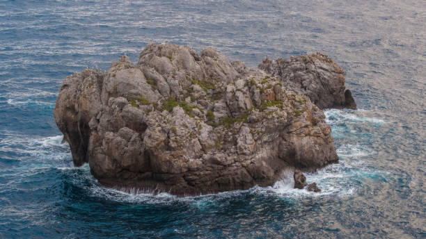 istock Dramatic Mediterranean Island aerial drone view with 1087881674