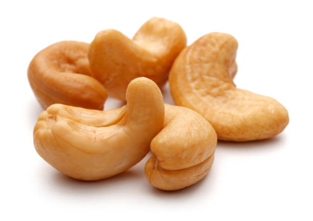 istock Group of cashew nuts on white background 1087881824
