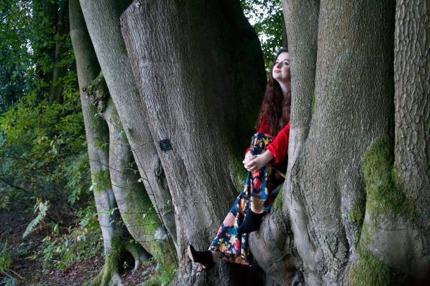 istock Fashionable lady in a beech tree 1087884154
