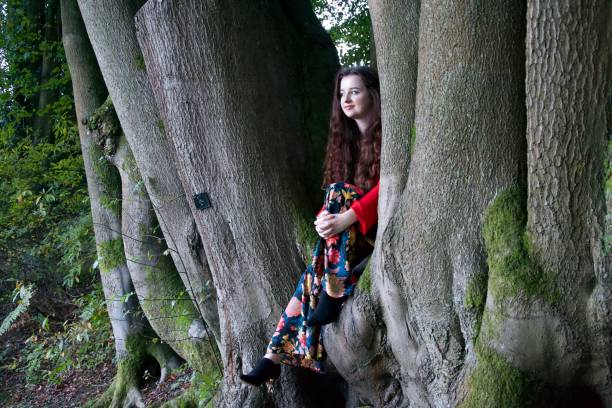 istock Fashionable lady in a beech tree 1087884252