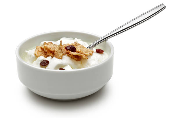 istock Cereal and yoghurt in bowl on white background 1087885720