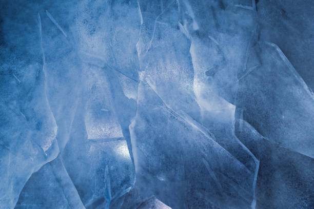 istock Cracked ice texture. Winter frosty weather concept 1087904520