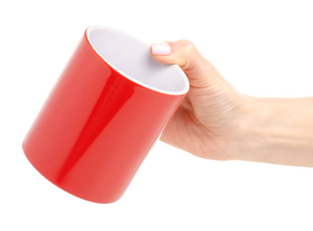 istock Red cup mug in female hand 1087906560