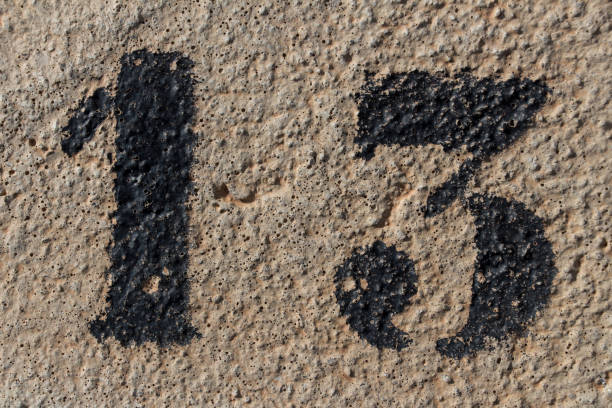 istock number thirteen painted stencil on concrete wall 1087906632
