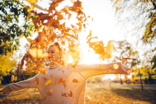 Throwing leaves in the air