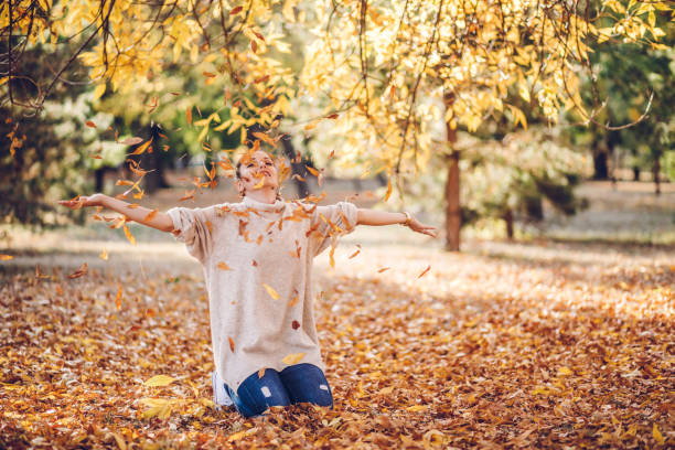 istock Throwing leaves in the air 1087907812