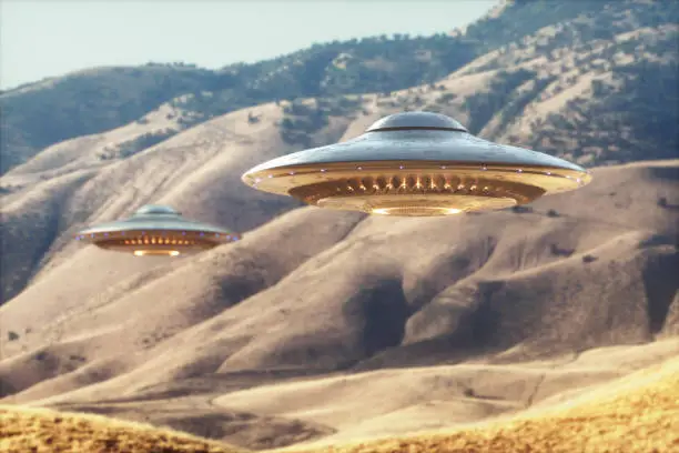 Two unidentified flying objects - UFO, flying over the sunny desert.