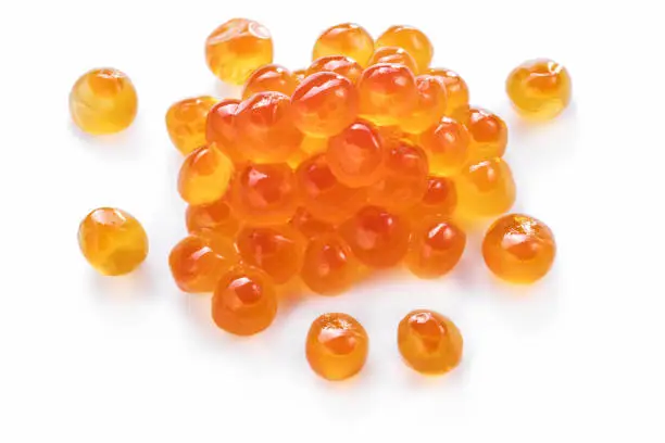 Red caviar or fish roe eggs on white background.  Clipping path.