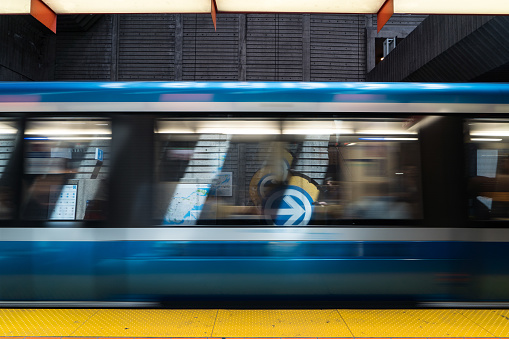 Motion blur of a moving metro car in Montreal's subway station.