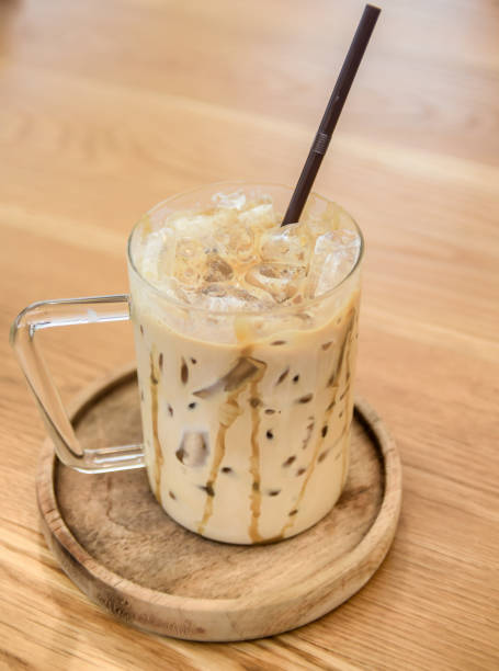 istock Ice coffee on wooden table 1087916866