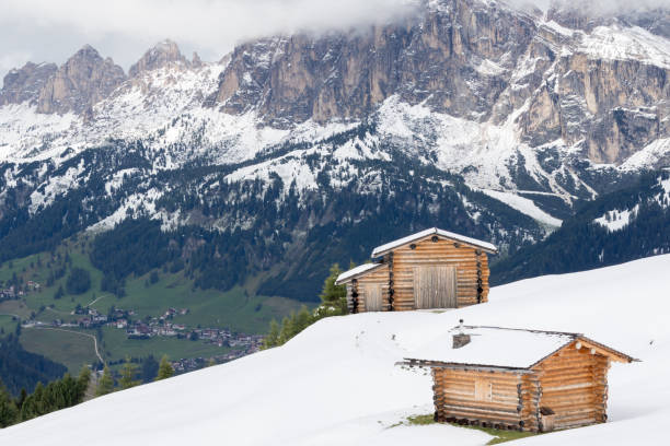 istock Alpine landscape with snowy meadows and huts 1087925288