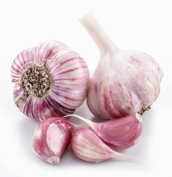 istock Garlic bulbs and garlic cloves. 1087925404