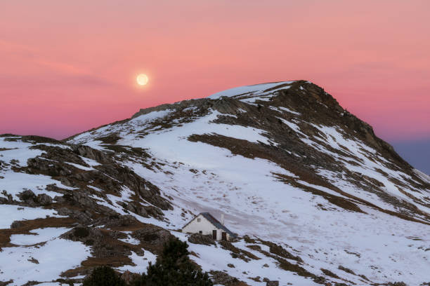 istock Full moon over Larra covered by snow in December 1087930776