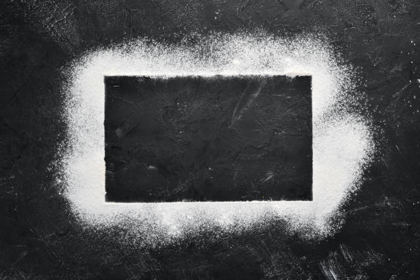 istock Flour on a black stone background. Top view. Free copy space. 1087932782