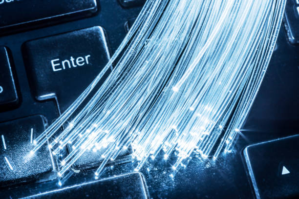istock Bundle of optical fibers with lights in the ends lay. 1087934130