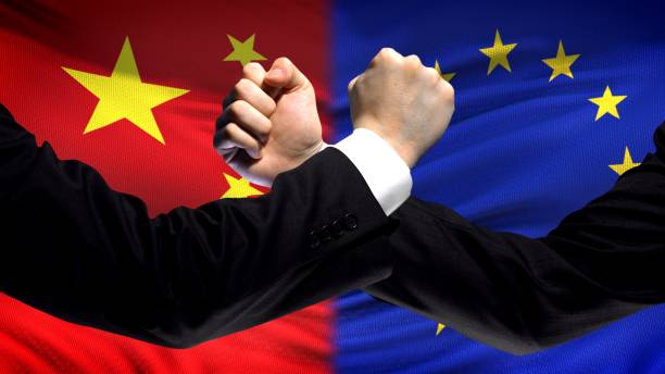 istock China vs EU confrontation, countries disagreement, fists on flag background 1087936748