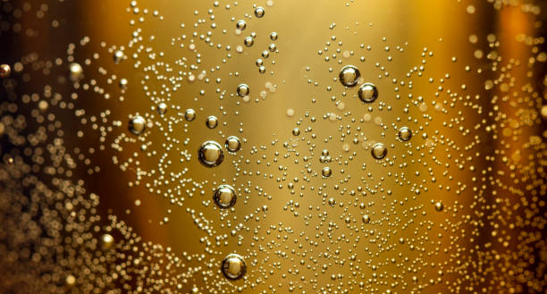 istock Water Drops On Orange Background Texture Cola colorful waterdrop 1087944734