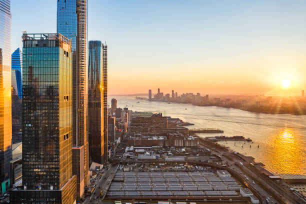 Aerial New York City waterfront skyline Aerial New York City waterfront skyline at sunset viewed from Hudson Yards towards Jersey City accross Hudson River. hudson river stock pictures, royalty-free photos & images
