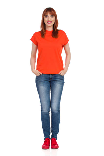 istock Young Woman Is Standing, Smiling And Looking At Camera. Front View. 1087976864