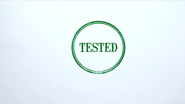 Tested seal stamped on blank paper background, approved results, examination