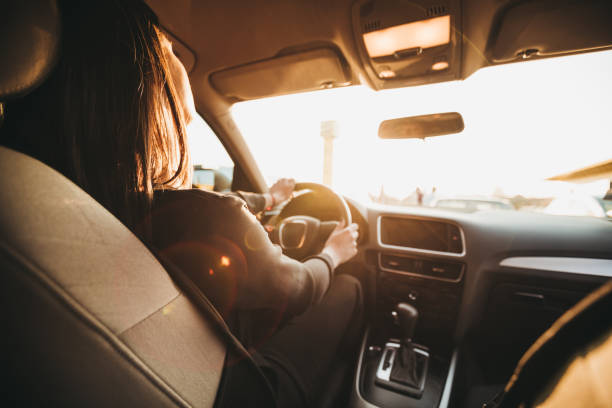 istock Businesswoman driving a car 1087982676
